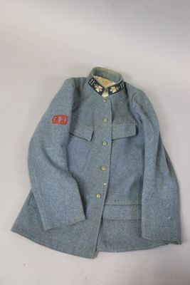an image of a blue jacket with a red emblem on it