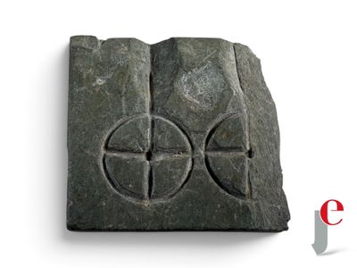 an image of a stone block with a cross on it