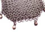silver chain mail chain with bells on it on a white background