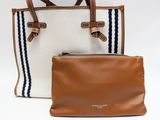 the two bags are sitting next to each other on the table
