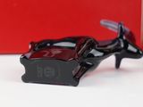 a black shoe that is sitting on top of a table