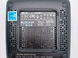 an image of a close up of a black electronic device on a white surface
