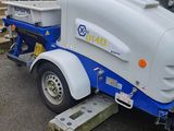 a white and blue trailer parked in a parking lot