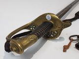 an image of a sword and a key on a table