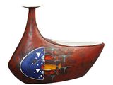 a red vase with a blue and orange design on it