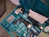a blue tool box with tools in it on the floor