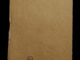an old piece of paper with a hole in the middle of it