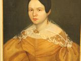 portrait of a woman in a yellow dress in a gold frame