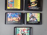 four gameboy games on the table next to each other