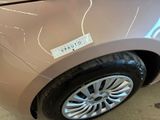 a close up of a car with a sticker on the side of it