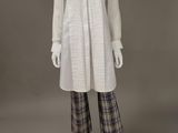 a white shirt and plaid pants on a mannequin mannequin mannequin mannequin mannequin mannequin mannequin mannequin
