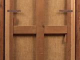 an old wooden cabinet with a glass door in it