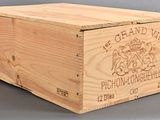 a wooden box with a logo on it on a table