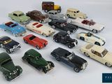 a lot of toy cars that are sitting on a table