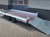 a trailer with a ramp attached to the side of it