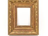 an old picture frame on a white wall with a white background