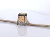 a bottle of wine with a cork stopper on top of it