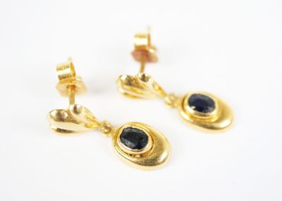 gold plated earrings with a blue sapphire stone