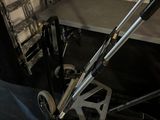 a dolly that is sitting on the floor next to a ladder