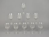 a lot of wine glasses sitting on a table