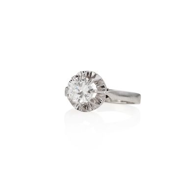 a diamond single - stone ring set in 18k white gold