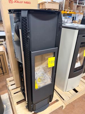 two black and silver refrigerators on a pallet in a store