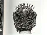 an open book with black and white illustrations of a woman ' s hair