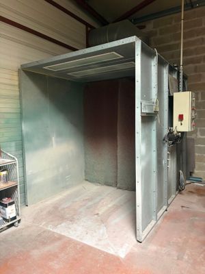a large metal box in the middle of a room