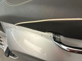 a close up of a car door handle on a motorcycle