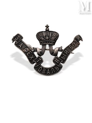 a close up of a badge with a crown on it