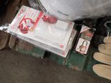 a box of gloves, gloves, and other items on a pallet