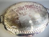 a silver plate with a picture on it on a table