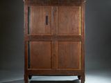 an image of a wooden cabinet against a dark background