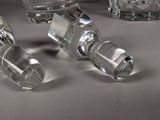 three glass bottles sitting next to each other on a table