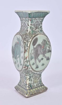 a vase that has a picture of a cat on it