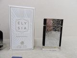 a bottle of perfume next to a box on a table