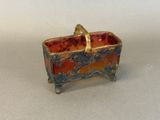 an image of a small box with a handle on a table