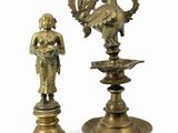 pair of antique brass figurines of a woman and a bird