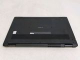 a laptop that is sitting on a white surface