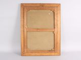 an old wooden frame with a picture hanging on the wall