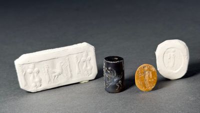 three different types of soap on a table next to a penny