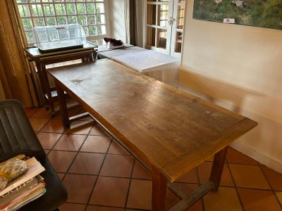 a large wooden table in the middle of a room