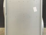 an image of a refrigerator in a room with a black wall