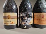 three bottles of wine sitting next to each other on a table
