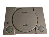 a sony playstation game system sitting on top of a table