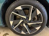 a close up of a tire on a blue car