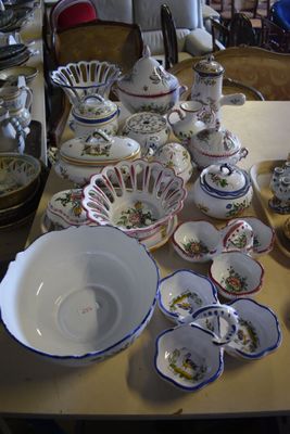 a table that has a lot of dishes and cups on it
