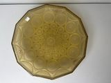 a glass plate with a design on it on a table