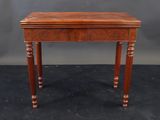 a small wooden table with a drawer on top of it