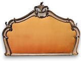 an antique mirror with a gold frame and a clock on it